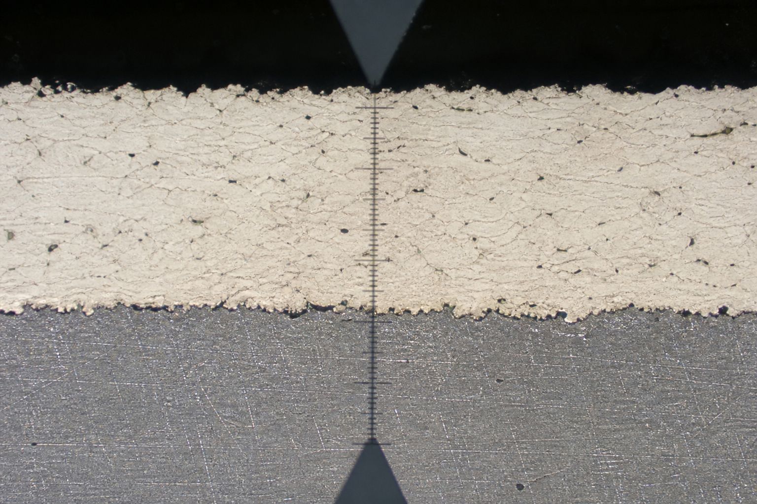 Thermal spray coating cross-section on steel with thickness measurement